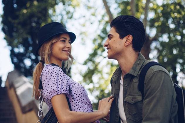 Young cheerful couple in casual clothes having fun during dating outdoors, Model released Copyright: xRamonxLopezx MR