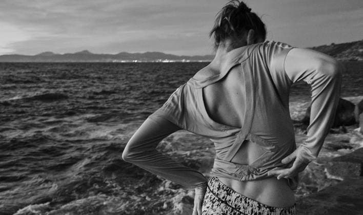 Woman taking off sweater near sea Copyright: xJeroxForradellasx Model Released