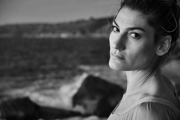 Woman taking off sweater near sea Copyright: xJeroxForradellasx Model Released