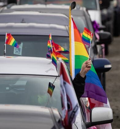 January 17, 2021, Mission, BC, Canada: A motorist holds a rainbow flag while waiting to participate in an anti-bullying parade of more than 1,000 vehicles in support of a transgender teenager who was allegedly assaulted outside a school, in Mission, B.C., on Sunday, January 17, 2021. According to RCMP two students were arrested and charges were recommended in regards to the incident that was recorded and posted online. Mission Canada - ZUMAc35_ 20210117_zaf_c35_054 Copyright: xDarrylxDyckx
