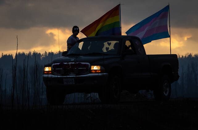 January 17, 2021, Mission, BC, Canada: A rainbow and transgender pride flag are flown on a truck participating in an anti-bullying parade of more than 1,000 vehicles in support of a transgender teenager who was allegedly assaulted outside a school, in Mission, B.C., on Sunday, January 17, 2021. According to RCMP two students were arrested and charges were recommended in regards to the incident that was recorded and posted online. Mission Canada - ZUMAc35_ 20210117_zaf_c35_055 Copyright: xDarrylxDyckx