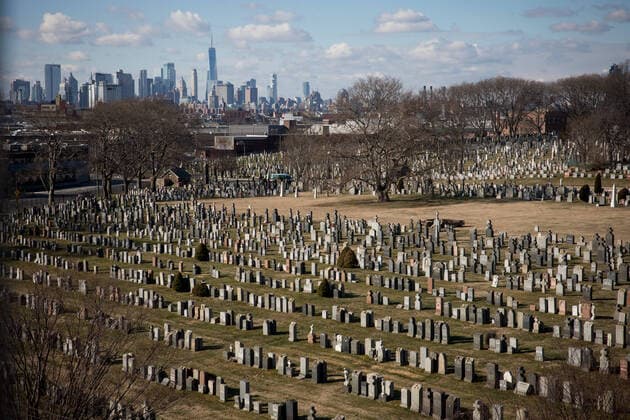 (210118) -- NEW YORK, Jan. 18, 2021 -- The Manhattan skyline is seen behind Calvary Cemetery in New York, the United States, on Jan. 18, 2021. The total number of COVID-19 cases in the United States topped 24 million on Monday, according to the Center for Systems Science and Engineering (CSSE) at Johns Hopkins University. U.S. COVID-19 case count rose to 24,018,793 with a total of 398,307 deaths, as of 2:21 p.m. local time (1921 GMT), according to the CSSE tally. (Photo by Michael Nagle Xinhua) U.S.-NEW YORK-COVID-19-CASES-24 MILLION MichaelxNagle WangxYing