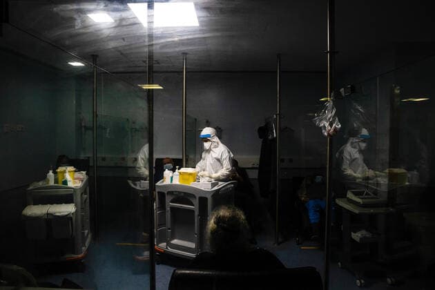 January 23, 2021, Porto, Portugal: A health worker wearing a protective suit attends to an infected patient in a ward at the University Hospital of Sao Joao do Porto..The University Hospital of Sao Joao do Porto, a central hospital in the northern region, receives patients with Covid-19. Portugal currently has 609,136 confirmed cases, 441,556 recoveries and 9,920 death, making it the worst country in the world with the most new cases per million inhabitants. Porto Portugal - ZUMAs197 20210123_zaa_s197_229 Copyright: xRitaxFranÃAx