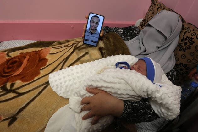 February 18, 2021, khan Younis, Gaza Strip, Palestinian Territory: The wife of the Palestinian prisoner Mohammad al-Qudra, holds her newborn baby, from whom she conceived with sperm smuggled out of an Israeli prison, at Nasser Medical Complex in khan Younis in the southern of Gaza strip on February 18, 2021. Since 2004, Palestinian security prisoners, who are denied conjugal visitations by their wives, have tried to smuggle their sperm out of Israeli prisons, so that their wives can be inseminated in fertility clinics in the West Bank and Ghazza, and bear them children khan Younis Palestinian Territory - ZUMAap3_ 20210218_zaf_ap3_193 Copyright: xAshrafxAmrax