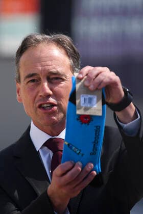 ACT COVID19 VACCINE ROLLOUT, Australian Health Minister Greg Hunt holds up a pair of socks depicting a syringe and a virus after the start of the Biotech Pfizer COVID-19 vaccine rollout at the COVID-19 surge centre in Canberra, Monday, February 22, 2021. Australia will begin its roll out of the Pfizer coronavirus vaccine on Monday, the country s most complicated logistical exercise to date. ( NO ARCHIVING, EDITORIAL USE ONLY, NO USE IN BOOKS WITHOUT CONSENT CANBERRA ACT AUSTRALIA Copyright: xLUKASxCOCHx 20210222001522295363