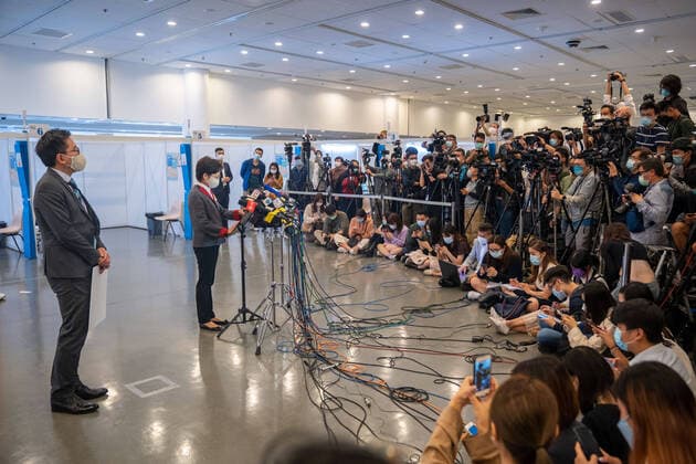 February 22, 2021, Hong Kong, China: Carrie Lam (L2), Hong Kong Chief Executive speaks to the media at the Community Vaccination Centre at the Hong Kong Central Library after getting the COVID-19 vaccination..Hong Kong Chief Executive Carrie Lam and members of her cabinet receive their first dose of of the COVID-19 vaccine in a bid to boost public confidence to the vaccine as the vaccination program for the public will begin on 26th February. Hong Kong China - ZUMAs197 20210222_zaa_s197_011 Copyright: xGeovienxSox