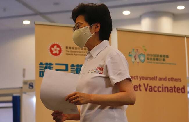 February 22, 2021, HONG KONG, CHINA: HKSAR Chief Executive Carrie Lam walks away with vaccination record after having received Sinovac Covid-19 vaccine at temporary set up vaccination centre at the public library.Feb-22,2021Hong Kong.ZUMA HONG KONG CHINA - ZUMAl137 20210222_zap_l137_013 Copyright: xLiauxChung-renx