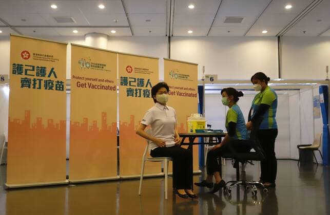 February 22, 2021, HONG KONG, CHINA: HKSAR Chief Executive Carrie Lam ( centre ) arriving at temporal Community Centre being set up at public library ready to receive Covid-19 vaccination using China-made SINOVAC Covid-19 vaccine. Carrie Lam kick-started a citywide campaign promoting Covid-19 vaccination program today in Hong Kong.Feb-22,2021Hong Kong.ZUMA HONG KONG CHINA - ZUMAl137 20210222_zap_l137_016 Copyright: xLiauxChung-renx