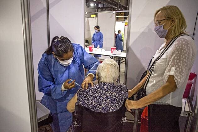 February 22, 2021, Buenos Aires, Federal Capital, Argentina: The Government of the City of Buenos Aires began this morning with the second stage of the vaccination plan against COVID-19. The first delivery of 40,000 Oxford-AstraZeneca Covishield vaccines, manufactured in India, will be aimed at adults over 80 years of age and those residing in nursing homes. To begin with, this Monday is scheduled to serve approximately 5,000 people..Mrs. Norida, 82, of Venezuelan nationality, with permanent residence in the City of Buenos Aires, receives the Covishield vaccine Buenos Aires Argentina - ZUMAa179 20210222_zap_a179_004 Copyright: xRobertoxAlmeidaxAveledox