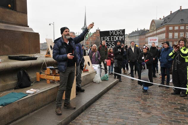 Copenhagen, Denmark. 23 February 2021, Danes proetesting againest coronavirus pandemic new debate in danish parliamenet about quick corona virus pandemic law in danish parliament with all political parties and stage anti pandemic law debates in front of danish parliament and danish police stand peaceful proteact danish parliament in front christiansborg danish parliament in Copenhagen. (Photo..Francis Dean Deanpictures)