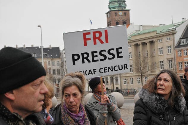 Copenhagen, Denmark. 23 February 2021, Danes proetesting againest coronavirus pandemic new debate in danish parliamenet about quick corona virus pandemic law in danish parliament with all political parties and stage anti pandemic law debates in front of danish parliament and danish police stand peaceful proteact danish parliament in front christiansborg danish parliament in Copenhagen. (Photo..Francis Dean Deanpictures)