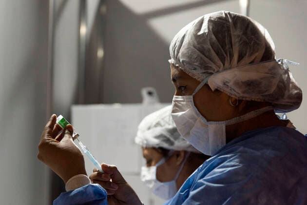 February 23, 2021, City of Buenos Aires, City of Buenos Aires, Argentina: INT. WorldNews. COVID-19. February 23, 2021. City of Buenos Aires, Argentina.- Two nurses prepare the vaccine injection for SARS CoV2 (COVID-19) on Feb 23, 2021, at a temporary Vaccination Center at Centro Cultural Recoleta, City of Buenos Aires, Argentina..Adults over 80 years old are being vaccinated for SARS CoV2 (COVID-19) since Feb 22, 2021 in City of Buenos Aires. City of Buenos Aires Argentina - ZUMAf135 20210223_zap_f135_008 Copyright: xJulietaxFerrariox