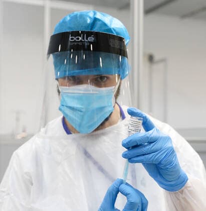 A health professional holds a vial with the vaccine against COVID-19 from AstraZeneca, in the Pavilion 3 of the Public Hospital Enfermera Isabel Zendal, in Madrid, (Spain), on February 23, 2021. This Tuesday begins the vaccination in the pavilion 3 of the hospital with the vaccine of AstraZeneca to 400 people of External Health, AENA, inspectors of Public Health, of Institute of Social Security, professionals of reformatories, Forensic Doctors, Students of CC Health and veterinarians. These new groups to be vaccinated will be joined by those over 80 years of age on Thursday 25 February in the Primary Care centres of each of the health areas of the community with 50,000 doses. 23 FEBRUARY 2021;ISABEL DÃAZ AYUSO;AYUSO;MADRID;COMMUNITY OF MAD Copyright: xLagenciaEPxPRESS M.FERNÃNDEZ.xPOOLx 3576564