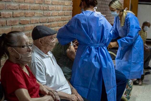 February 25, 2021, Firmat, Santa Fe, Argentina: Nurse apply a shot of India s Serum Institute Covishield vaccine against COVID-19 to elderly people inside a makeshift care home functioning in a special school. The original care home inside San Martin Hospital was converted into the COVID-19 sector at the beginning of the pandemic, and the residents were moved into this location. Firmat Argentina - ZUMAm105 20210225_zaf_m105_010 Copyright: xPatricioxMurphyx