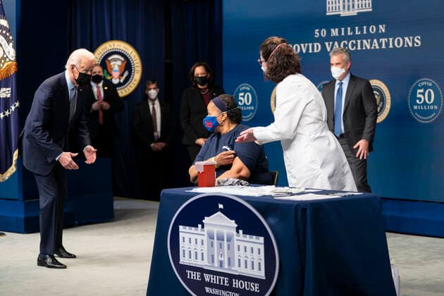 February 25, 2021, Washington, District of Columbia, USA: Before getting her Covid Vaccine, President Joe Biden talks with Linda Bussey, who has worked at Safeway for 37 years and currently serves a general merchandise manager in Bethesda, MD. Ms. Bussey lives in Southeast DC. Ms. Bussey has been working ever since the pandemic. as he participates in an event commemorating the 50 million COVID-19 vaccine shot during a ceremony at the White House, Thursday, Feb. 25, 2021. Ms. Bussey lives in Southeast DC. Ms. Bussey has been working ever since the pandemic Washington USA - ZUMAs152 20210225_zaa_s152_214 Copyright: xDougxMillsx