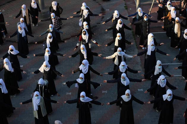 February 27, 2021, Gaza city, Gaza Strip, Palestinian Territory: Palestinian students wearing protective face masks, return back to their school, in the morning of the first day of the second semester study, amid the coronavirus disease (COVID-19) outbreak, in Dair Al Balah in the central of Gaza Strip, on February 27, 2021 Gaza city Palestinian Territory - ZUMAap3_ 20210227_zaf_ap3_082 Copyright: xAshrafxAmrax