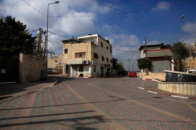 February 28, 2021, Jenin, West Bank, Palestinian Territory: A deserted street is pictured during a complete closure, amid the coronavirus lockdown in the town of Zababdeh, south of Jenin, in the West Bank on February 28, 2021. Prime Minister Mohammad Shtayyeh announced a new set of restrictions in response to a recent surge in coronavirus infections, including of British and South African mutants, in Palestine.A lockdown of all public and private schools for all classes, except for high school students for a period of 12 days, including kindergartens..A lockdown of all universities, educational and vocational institutes and shifting to distance e-learning programs. A maximum of 50 percent of administrative staff are allowed access to univer - ZUMAap3_ 20210228_zaf_ap3_040 Copyright: xOdayxDaibesx