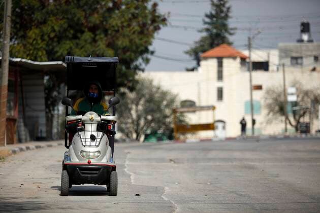 February 28, 2021, Jenin, West Bank, Palestinian Territory: A man walks on an empty street, amid the coronavirus lockdown in the town of Zababdeh, south of Jenin, in the West Bank on February 28, 2021. Prime Minister Mohammad Shtayyeh announced a new set of restrictions in response to a recent surge in coronavirus infections, including of British and South African mutants, in Palestine.A lockdown of all public and private schools for all classes, except for high school students for a period of 12 days, including kindergartens..A lockdown of all universities, educational and vocational institutes and shifting to distance e-learning programs. A maximum of 50 percent of administrative staff are allowed access to universities..Movement between - ZUMAap3_ 20210228_zaf_ap3_042 Copyright: xOdayxDaibesx