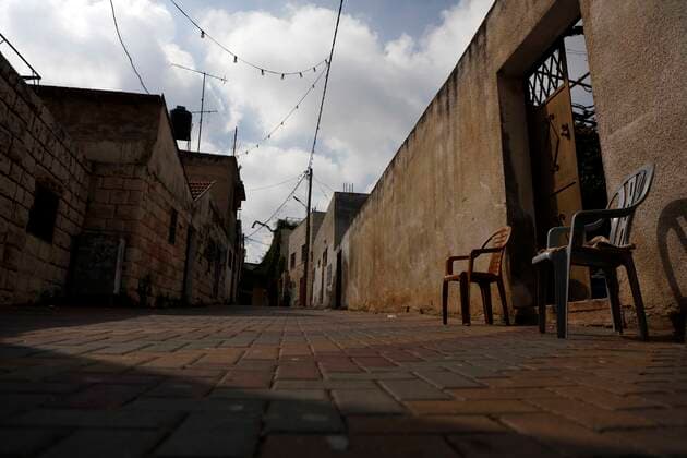 February 28, 2021, Jenin, West Bank, Palestinian Territory: A deserted street is pictured during a complete closure, amid the coronavirus lockdown in the town of Zababdeh, south of Jenin, in the West Bank on February 28, 2021. Prime Minister Mohammad Shtayyeh announced a new set of restrictions in response to a recent surge in coronavirus infections, including of British and South African mutants, in Palestine.A lockdown of all public and private schools for all classes, except for high school students for a period of 12 days, including kindergartens..A lockdown of all universities, educational and vocational institutes and shifting to distance e-learning programs. A maximum of 50 percent of administrative staff are allowed access to univer - ZUMAap3_ 20210228_zaf_ap3_050 Copyright: xOdayxDaibesx