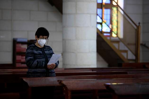 February 28, 2021, Jenin, West Bank, Palestinian Territory: Christian worshippers pray inside Church, amid the coronavirus lockdown in the town of Zababdeh, south of Jenin, in the West Bank on February 28, 2021. Prime Minister Mohammad Shtayyeh announced a new set of restrictions in response to a recent surge in coronavirus infections, including of British and South African mutants, in Palestine.A lockdown of all public and private schools for all classes, except for high school students for a period of 12 days, including kindergartens..A lockdown of all universities, educational and vocational institutes and shifting to distance e-learning programs. A maximum of 50 percent of administrative staff are allowed access to universities..Movemen - ZUMAap3_ 20210228_zaf_ap3_059 Copyright: xOdayxDaibesx