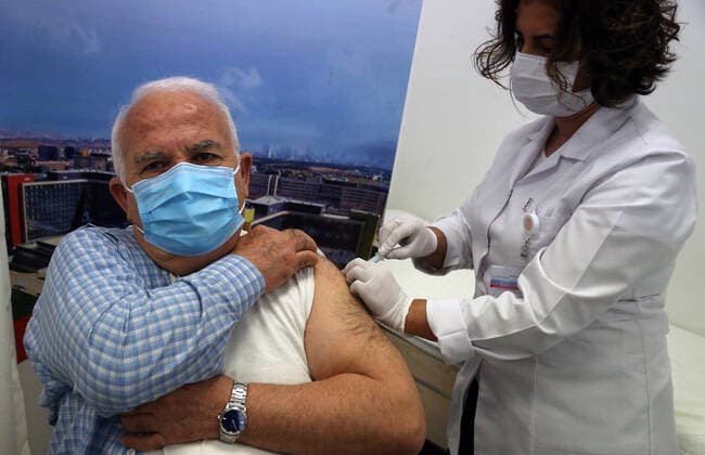 (210302) -- ANKARA, March 2, 2021 -- A man receives the COVID-19 vaccine in Ankara, Turkey on March 1, 2021. Turkey on Monday reported 9,891 new COVID-19 cases, including 645 symptomatic ones, raising the total number in the country to 2,711,479, according to the health ministry. The country started mass vaccination for COVID-19 on Jan. 14 after the authorities approved the emergency use of the Chinese CoronaVac vaccine. About 7,046,000 people have been vaccinated so far. (Photo by Xinhua) TURKEY-ANKARA-COVID-19-VACCINATION MustafaxKaya