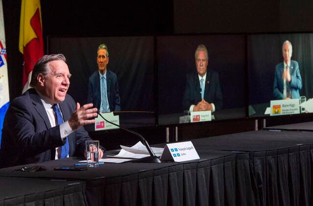 March 4, 2021, Montreal, PQ, Canada: Quebec Premier Francois Legault chairs a premiers virtual news conference as premiers Brian Pallister, Manitoba, Doug Ford, Ontario and Blaine Higgs, New Brunswick are seen on screen, Thursday, March 4, 2021 in Montreal. Montreal Canada - ZUMAc35_ 20210304_zaf_c35_037 Copyright: xRyanxRemiorzx