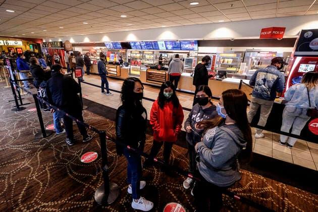 March 15, 2021, Los Angeles, California, USA: Moviegoers wait in line to buy food and drinks at the AMC Theater on the first day of reopened theaters after being closed due to the COVID-19 pandemic in Burbank, California, on March 15, 2021. Los Angeles County restaurants can again welcome customers indoors, and movie theaters and fitness centers are able to reopen, all at limited capacity, with the county advancing today to the less-restrictive red tier of the state s Blueprint for a Safer Economy. Los Angeles USA - ZUMAc68_ 20210315_zaf_c68_014 Copyright: xRingoxChiux