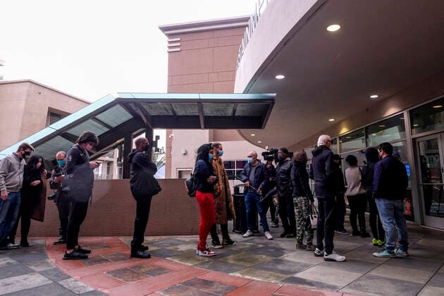 March 15, 2021, Los Angeles, California, USA: Moviegoers wait in line to enter the AMC Theater on the first day of reopened theaters after being closed due to the COVID-19 pandemic in Burbank, California, on March 15, 2021. Los Angeles County restaurants can again welcome customers indoors, and movie theaters and fitness centers are able to reopen, all at limited capacity, with the county advancing today to the less-restrictive red tier of the state s Blueprint for a Safer Economy. Los Angeles USA - ZUMAc68_ 20210315_zaf_c68_016 Copyright: xRingoxChiux