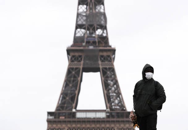 (210317) -- PARIS, March 17, 2021 -- A street vendor is seen at the Trocadero Place near the Eiffel Tower in Paris, France, March 17, 2021. France has entered a form of third wave (of the coronavirus pandemic) characterized by numerous virus variants, Prime Minister Jean Castex said on Tuesday, stressing that his government still considers vaccination a top priority of its strategy to stem the spread of the virus. On Tuesday, the health authorities reported 29,975 new infections across the country, bringing the cumulative total to 4,108,108. The number of single-day deaths jumped to 408, taking the total to 91,170. ) FRANCE-PARIS-COVID-19-THIRD WAVE GaoxJing