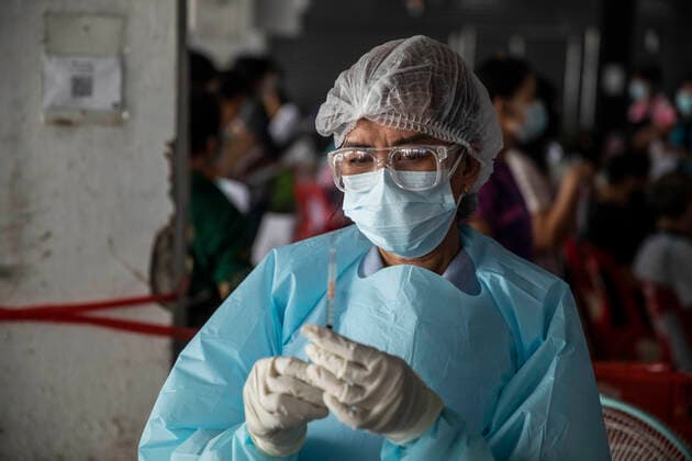 March 19, 2021, Thailand: A health worker prepares a dose of CoronaVac, a Covid-19 coronavirus vaccine developed by Chinaâ€⠢s Sinovac Biotech ltd, in Bangkok, Thailand, on Friday March 19, 2021. Health workers have been vaccinating 600 residents per day, after a cluster of Covid-19 coronavirus cases were discovered at the Bang Khae market in Bangkok on Wednesday, March 17. Thailand - ZUMAm249 20210319_zip_m249_001 Copyright: xAndrexMalerbax