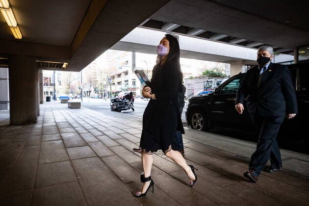 March 22, 2021, Vancouver, BC, Canada: Meng Wanzhou, chief financial officer of Huawei, carries a binder of documents as she arrives at B.C. Supreme Court, in Vancouver, on Monday, March 22, 2021. Vancouver Canada - ZUMAc35_ 20210322_zaf_c35_017 Copyright: xDarrylxDyckx