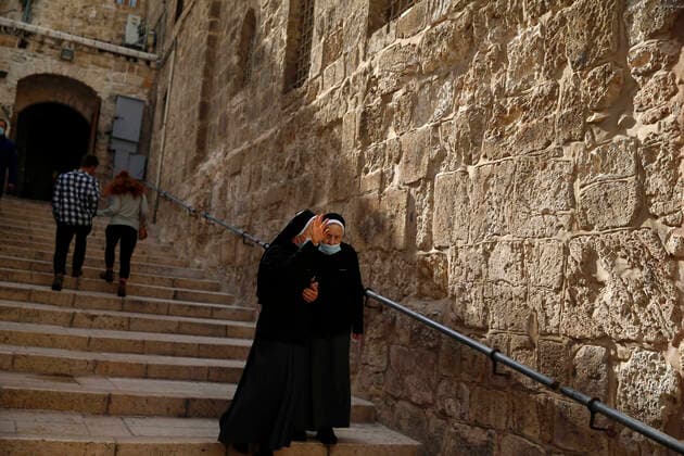 March 25, 2021, Jerusalem, West Bank, Palestinian Territory: Christian worshipers walk inside Church of Holy Sepulcher, amid the coronavirus lockdown, in Jerusalem s Old City, on March 25, 2021. The Palestinian government decided to re-apply the partial closure in the West Bank, with the continued suspension of schools, with the exception of high school students, until April 3 to confront the spread of the Corona virus. The government spokesman said in a statement that it has also been decided that the closure will continue on Friday and Saturday of every week, except for pharmacies and bakeries Jerusalem Palestinian Territory - ZUMAap3_ 20210325_zaf_ap3_081 Copyright: xJamalxAwadx