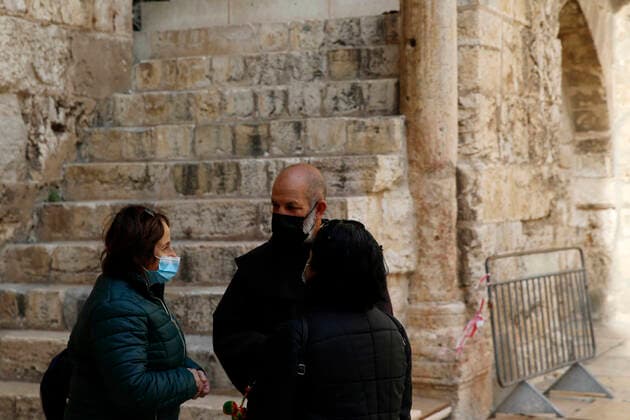 March 25, 2021, Jerusalem, West Bank, Palestinian Territory: Christian worshipers walk inside Church of Holy Sepulcher, amid the coronavirus lockdown, in Jerusalem s Old City, on March 25, 2021. The Palestinian government decided to re-apply the partial closure in the West Bank, with the continued suspension of schools, with the exception of high school students, until April 3 to confront the spread of the Corona virus. The government spokesman said in a statement that it has also been decided that the closure will continue on Friday and Saturday of every week, except for pharmacies and bakeries Jerusalem Palestinian Territory - ZUMAap3_ 20210325_zaf_ap3_086 Copyright: xJamalxAwadx