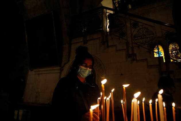 March 25, 2021, Jerusalem, West Bank, Palestinian Territory: Christian worshippers pray inside Church of Holy Sepulcher, amid the coronavirus lockdown, in Jerusalem s Old City, on March 25, 2021. The Palestinian government decided to re-apply the partial closure in the West Bank, with the continued suspension of schools, with the exception of high school students, until April 3 to confront the spread of the Corona virus. The government spokesman said in a statement that it has also been decided that the closure will continue on Friday and Saturday of every week, except for pharmacies and bakeries Jerusalem Palestinian Territory - ZUMAap3_ 20210325_zaf_ap3_087 Copyright: xJamalxAwadx
