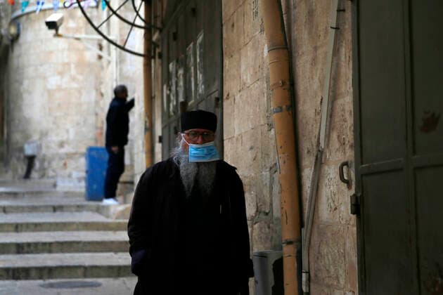 March 25, 2021, Jerusalem, West Bank, Palestinian Territory: Christian worshipers walk inside Church of Holy Sepulcher, amid the coronavirus lockdown, in Jerusalem s Old City, on March 25, 2021. The Palestinian government decided to re-apply the partial closure in the West Bank, with the continued suspension of schools, with the exception of high school students, until April 3 to confront the spread of the Corona virus. The government spokesman said in a statement that it has also been decided that the closure will continue on Friday and Saturday of every week, except for pharmacies and bakeries Jerusalem Palestinian Territory - ZUMAap3_ 20210325_zaf_ap3_092 Copyright: xJamalxAwadx
