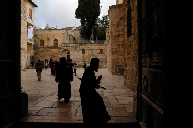 March 25, 2021, Jerusalem, West Bank, Palestinian Territory: Christian worshipers walk inside Church of Holy Sepulcher, amid the coronavirus lockdown, in Jerusalem s Old City, on March 25, 2021. The Palestinian government decided to re-apply the partial closure in the West Bank, with the continued suspension of schools, with the exception of high school students, until April 3 to confront the spread of the Corona virus. The government spokesman said in a statement that it has also been decided that the closure will continue on Friday and Saturday of every week, except for pharmacies and bakeries Jerusalem Palestinian Territory - ZUMAap3_ 20210325_zaf_ap3_094 Copyright: xJamalxAwadx