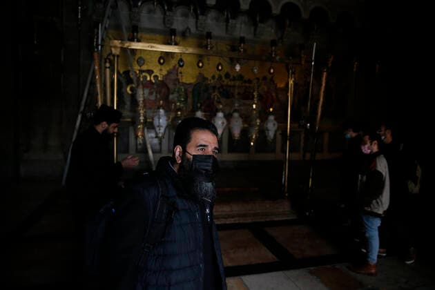 March 25, 2021, Jerusalem, West Bank, Palestinian Territory: Christian worshipers walk inside Church of Holy Sepulcher, amid the coronavirus lockdown, in Jerusalem s Old City, on March 25, 2021. The Palestinian government decided to re-apply the partial closure in the West Bank, with the continued suspension of schools, with the exception of high school students, until April 3 to confront the spread of the Corona virus. The government spokesman said in a statement that it has also been decided that the closure will continue on Friday and Saturday of every week, except for pharmacies and bakeries Jerusalem Palestinian Territory - ZUMAap3_ 20210325_zaf_ap3_097 Copyright: xJamalxAwadx