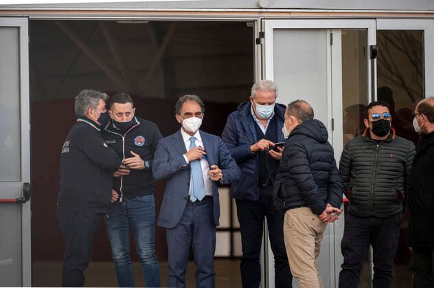 March 26, 2021, Catanzaro, Calabria, Italy: Mayor Sergio Abramo (c) seen among people at the hub. Lieutenant general, Francesco Paolo Figliuolo, recently appointed as extraordinary commissioner for the COVID-19 emergency, and Fabrizio Curcio, Head of Department of Civil Protection, visited new vaccination hubs in Calabria. In Catanzaro, in the seacoast district â€oeLidoâ€Â, they visited the new Trade Fair Center selected as potential hub. Sergio Abramo, Mayor of Catanzaro, and Antonino Spirlo¬, and temporary Regional Governor, guided them during the visit. The increasing of vaccination hubs is considered a priority, specially considering the rising number of cases within the region. Catanzaro Italy - ZUMAs197 20210326_zaa_s197_163 Copyright: xValeriaxFerrarox