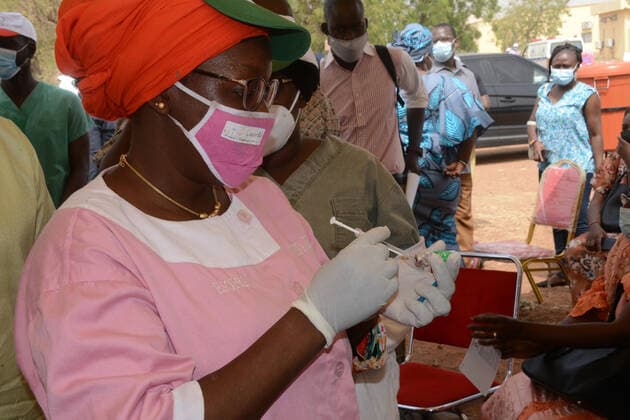 (210331) -- BAMAKO, March 31, 2021 -- A nurse prepares a dose of the COVID-19 vaccine in Bamako, Mali, on March 31, 2021. Malian Minister of Health and Social Development Fanta Siby received Wednesday her first dose of COVID-19 vaccine, which symbolized the official kickoff of Mali s COVID-19 vaccination campaign. During this first phase of the vaccination campaign, according to the minister, a total of 21,406 health workers will be vaccinated in Bamako, epicenter of the pandemic in this West African country. (Photo by Xinhua) MALI-BAMAKO-COVID-19-VACCINATION HabibxKouyate