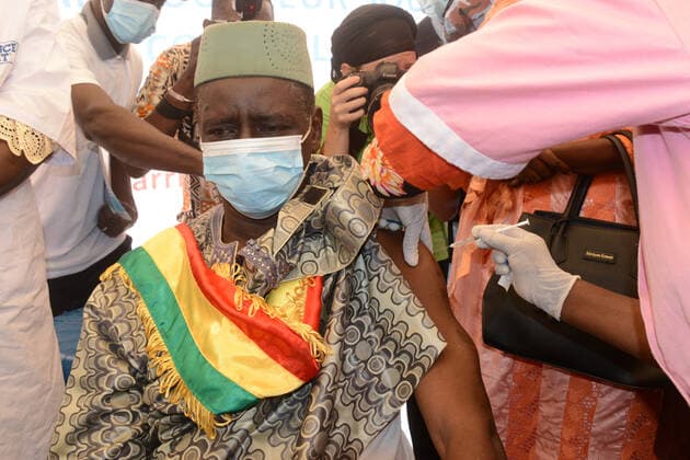(210331) -- BAMAKO, March 31, 2021 -- A man receives the COVID-19 vaccine in Bamako, Mali, on March 31, 2021. Malian Minister of Health and Social Development Fanta Siby received Wednesday her first dose of COVID-19 vaccine, which symbolized the official kickoff of Mali s COVID-19 vaccination campaign. During this first phase of the vaccination campaign, according to the minister, a total of 21,406 health workers will be vaccinated in Bamako, epicenter of the pandemic in this West African country. (Photo by Xinhua) MALI-BAMAKO-COVID-19-VACCINATION HabibxKouyate
