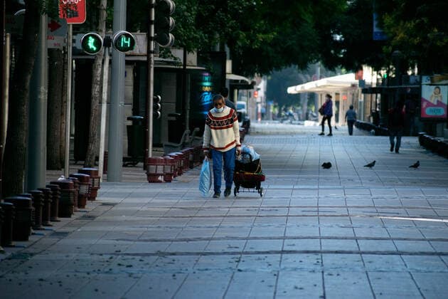 April 3, 2021, Santiago, Metropolitana, Chile: A man with a mask walks down an almost empty street in the center of Santiago, in the midst of the total quarantine decreed for the Metropolitan Region. The country is going through a second wave that is saturating hospitals. Today there were 8,112 new cases of coronavirus, a record number since the onset of the pandemic. Santiago Chile - ZUMAb332 20210403_zip_b332_002 Copyright: xMatiasxBasualdox