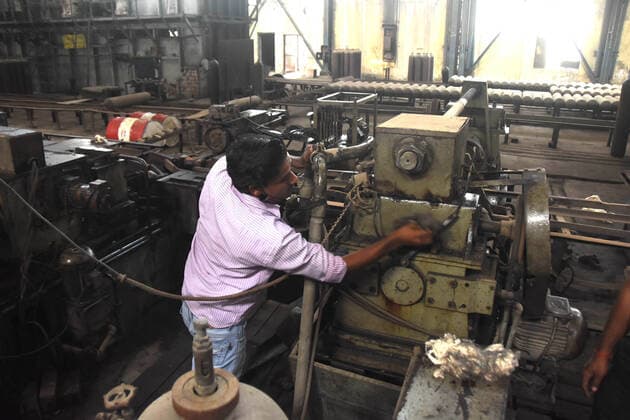 April 29, 2021, Prayagraj, Uttar Pradesh, India: Prayagraj: A worker repair machine use for making oxygen cylinder at Bharat Pump and Compressor limited(BPCL), public sector unit located in Naini area, amid a countrywide hike in coronavirus cases in Prayagraj on Thursday, April 29, 2021. Prayagraj India - ZUMAv115 20210429_zap_v115_013 Copyright: xPrabhatxKumarxVermax