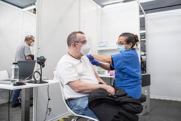 May 5, 2021, Barcelona, Catalonia, Spain: Man is seen being vaccinated..To accelerate the vaccination of COVID-19 and decongest primary care centers, the Barcelona s trade fair institution, Fira Barcelona, has become, since April 30, a mass vaccination center. It is the first in all of Catalonia, with the capacity to administer up to 120,000 vaccines a week. This space is added to the fifty municipal spaces enabled by the Barcelona City Council as COVID-19 vaccination spaces. Barcelona Spain - ZUMAd159 20210505_zia_d159_019 Copyright: xThiagoxPrudenciox