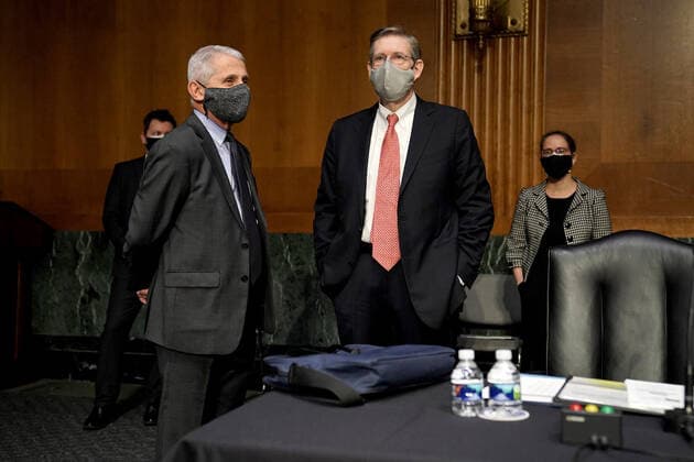 May 11, 2021, Washington, District of Columbia, USA: Dr. Anthony Fauci, director of the National Institute of Allergy and Infectious Diseases, speaks to Department of Health and Human Services Chief Science Officer for Covid Response David Kessler before a Senate Health, Education, Labor and Pensions Committee hearing to discuss the on-going federal response to Covid-19 on Tuesday, May 11, 2021 at the U.S. Capitol in Washington, D.C Washington USA - ZUMAs152 20210511_zaa_s152_001 Copyright: xGregxNashx-xPoolxViaxCnpx