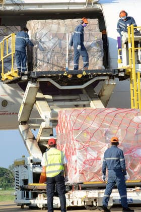 (210511) -- VIENTIANE, May 11, 2021 -- Workers unload anti-epidemic material supplies donated by the Chinese government from a Chinese cargo plane at Wattay International Airport in Vientiane, Laos, May 10, 2021. The Chinese government-donated anti-COVID-19 material supplies have arrived at Wattay International Airport in Lao capital Vientiane with a handover ceremony held upon their arrival. The Chinese government s emergency assistance to Laos includes ventilators, automatic nucleic acid extractors, medical masks, N95 masks, mobile hospital beds, automatic autoclaves, nucleic acid extraction or purification reagents, and nucleic acid detection kits, etc. ) LAOS-VIENTIANE-CHINA-ANTI-EPIDEMIC SUPPLIES-DONATION-ARRIVAL ZhangxJianhua