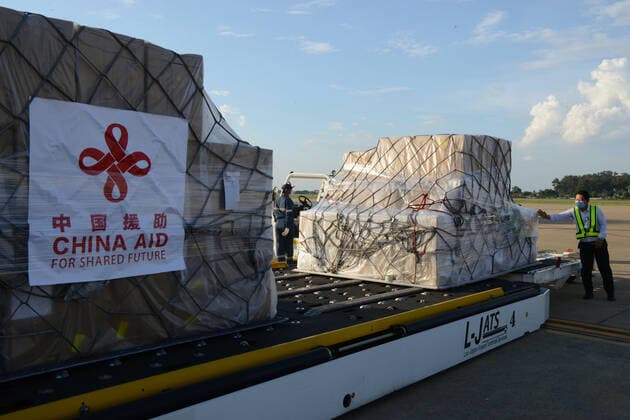 (210511) -- VIENTIANE, May 11, 2021 -- Workers transport anti-epidemic material supplies donated by the Chinese government at Wattay International Airport in Vientiane, Laos, May 10, 2021. The Chinese government-donated anti-COVID-19 material supplies have arrived at Wattay International Airport in Lao capital Vientiane with a handover ceremony held upon their arrival. The Chinese government s emergency assistance to Laos includes ventilators, automatic nucleic acid extractors, medical masks, N95 masks, mobile hospital beds, automatic autoclaves, nucleic acid extraction or purification reagents, and nucleic acid detection kits, etc. ) LAOS-VIENTIANE-CHINA-ANTI-EPIDEMIC SUPPLIES-DONATION-ARRIVAL ZhangxJianhua