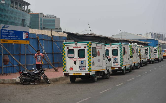 MUMBAI, INDIA ? MAY 15: Ambulances kept ready outside the BKC Jumbo Covid-19 Centre to shift patients if necessary, as Cyclone Tauktae intensifies and is likely to impact the Western coasts of Maharashtra with strong winds and heavy rain, on May 15, 2021 in Mumbai, India. As cyclone Tauktae furthers closer into the Indian West Coast, the Central Water Commission (CWC) on Saturday issued an orange bulletin for Kerala and Tamil Nadu, predicting a severe flood situation in the two states. More than 50 teams of the NDRF (National Disaster Response Force) are on duty in five states - Kerala, Karnataka, Tamil Nadu, Gujarat and Maharashtra. (Photo by Vijay Bate Hindustan Times ) Cyclone Tauktae May Intensify Into Very Severe Storm By Sunday; R