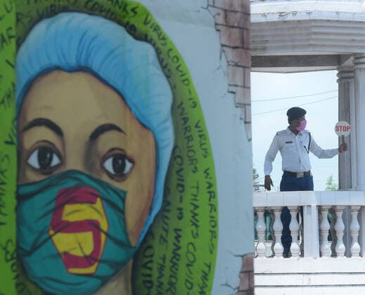 (210519) -- AGARTALA, May 19, 2021 -- A traffic policeman wearing a face mask is seen on duty during a curfew in Agartala, the capital city of India s northeastern state of Tripura, May 19, 2021. India s COVID-19 tally reached 25,496,330 on Wednesday, with 267,334 new cases registered in the past 24 hours, confirmed the health ministry. In a bid to flatten the COVID-19 cases curve most of the states in the country have imposed night curfews and partial or complete lockdowns. (Str Xinhua) INDIA-AGARTALA-COVID-19-CURFEW Stringer