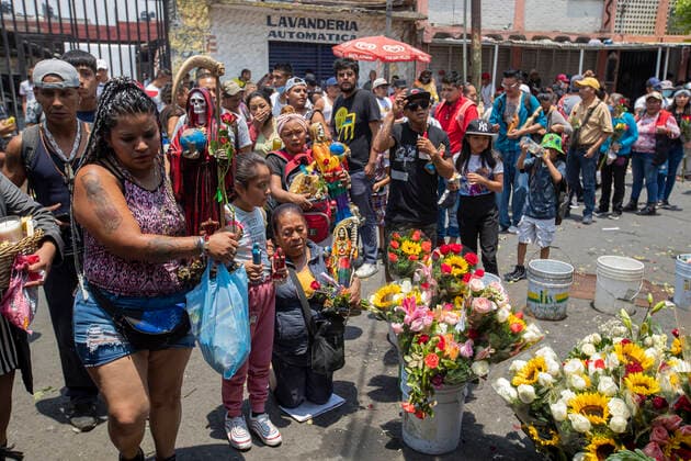 June 1, 2021, Mexico City, Mexico City, Mexico: A faithful holds a statue of Santa Muerte, while arriving at the Altar of Santa Muerte in the town of Tepito, as part of the celebrations that held on the first day of each month, hundreds of devotees attend to venerate it, give thanks for the favors and the fulfilled promises that this deity has granted them. La Santa Muerte or Santisima Muerte is a popular Mexican figure who personifies death and is an object of worship, the devotees of her are usually perceived as people associated with crime, gang activity, prostitution, drug trafficking. On June 1, 2021 in Mexico City, Mexico. Mexico City Mexico - ZUMAe321 20210601_zia_e321_012 Copyright: xRicardoxFloresx
