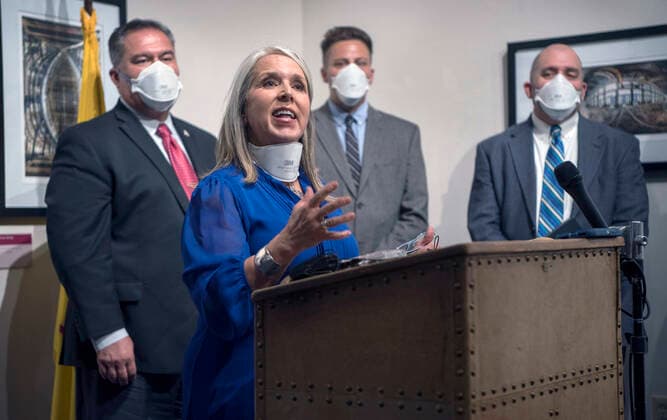 June 11, 2021, USA: Gov. Michelle Lujan Grisham, with Sen. Michael Padilla, D-Albuquerque, left, Matt Baca, chief council with the A.G. s Office, Mark Fidel, president of an Albuquerque cybersecurity firm, and others held a news conference to announce an investigation of possible fraud of pandemic relief money. The news conference was held at the Governor s Office Friday June 11, 2021. USA - ZUMAab1_ 20210611_zaf_ab1_014 Copyright: xEddiexMoorex